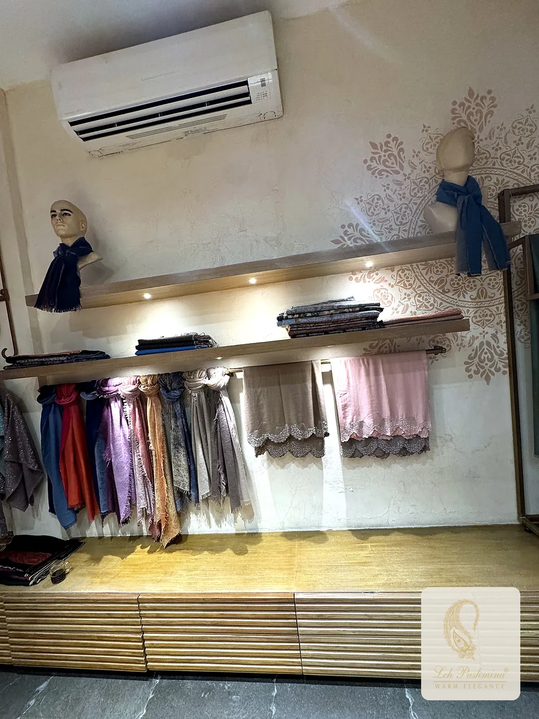 Embroidered stoles on the showroom wall
